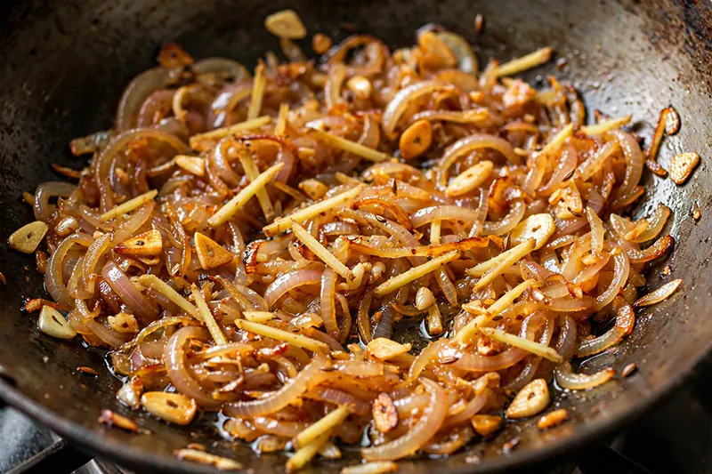 Authentic Black Bengal Gram Curry (Kala Chana Gravy) finely chopped onion 150g browned 6-8 minutes deep golden ginger garlic paste sweet roasted