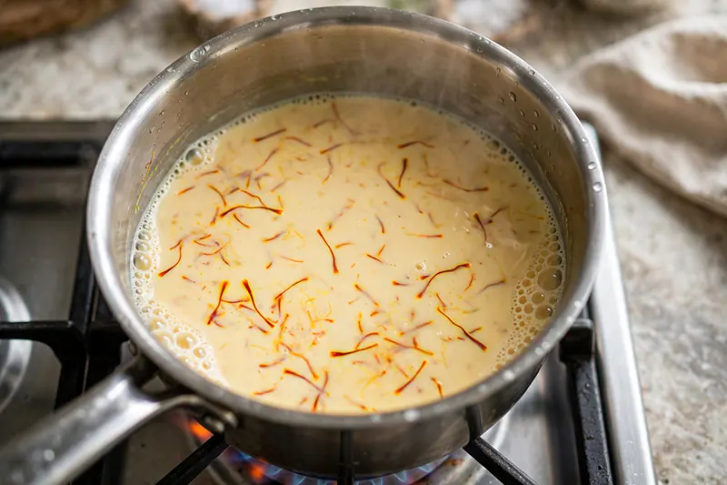 Dal Ka Seera (Traditional Moong Dal Halwa Recipe) Boil saffron and milk