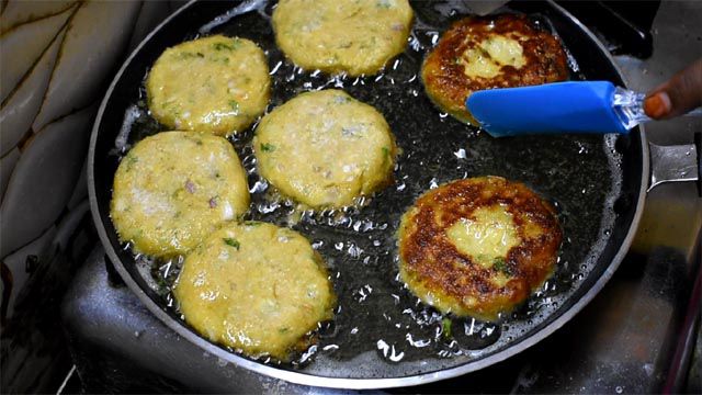 Flip Aloo Cutlet once they turn golden brown.