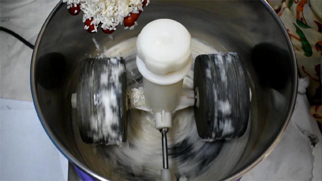 Grind rice in wet grinder to make Poornam Boorelu Recipe