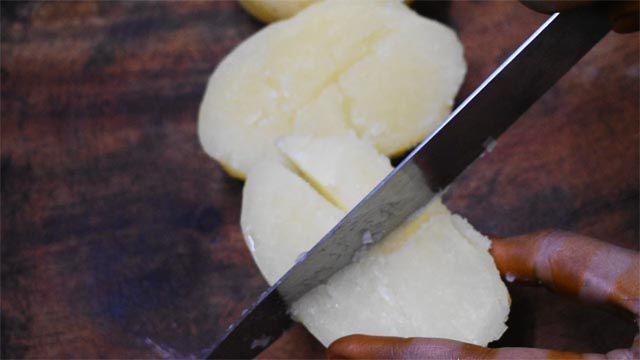 Boil and slice potatoes to  make aloo bhujia.