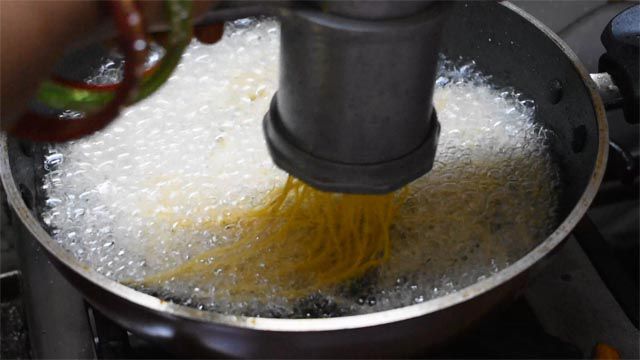 Press namkeen sev directly in hot oil.