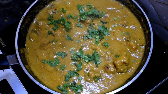 Garnish Chicken Korma Recipe with coriander leaves.