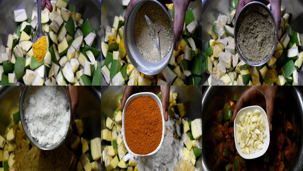 Layering and coating andhra avakaya pachadi with spices.